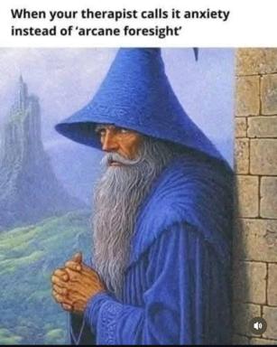 A wizard in blue robes looks pensively over a misty landscape. Text jokes about therapy calling anxiety "arcane foresight."