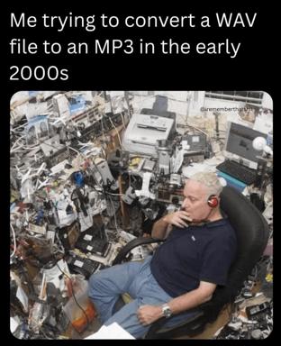 A man meditating amid a towering tangle of obsolete computer hardware, captioned on early-2000s audio conversion chaos. Nostalgia for the pre-ffmpeg era.