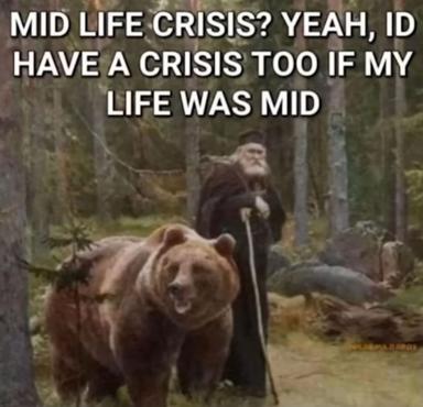 A medieval figure with a bear in a misty forest discusses having crises preemptively as a defence against middle-age irrelevance.