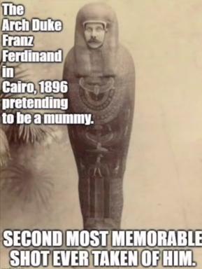Archduke Franz Ferdinand's head grafted onto an Egyptian mummy torso—a deadpan historical-absurdist meme claiming a fabricated Cairo photograph from 1896.