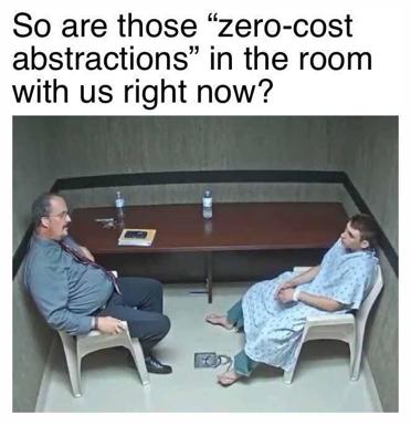 Two people in a bland conference room awkwardly interrogate whether programming jargon has somehow materialized in physical space.