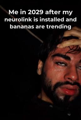 A close-up portrait of a man's face under dramatic side-lighting, looking down with a wry expression, captioned with an absurdist joke about neural implants and trending bananas in 2029.