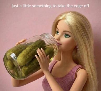 A blonde Barbie doll drinking pickles from a jar against a soft pink background, illustrating the phrase "just a little something to take the edge off."