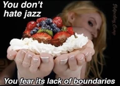 A person holds an overloaded dessert while explaining their real issue with jazz is lack of boundaries, not hatred of the genre itself.