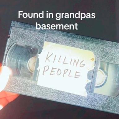 A VHS tape labeled "KILLING PEOPLE" in handwriting, presented as a darkly comedic discovery in grandpa's basement—absurdist internet humor playing on the juxtaposition of innocent nostalgic spaces with shocking content.