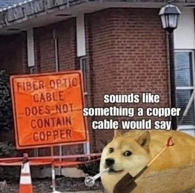 Doge meme riffing on a cautionary construction sign: a classic tan shiba inu contemplates fiber optic cable that carries no copper, amused by the obvious disclaimer.