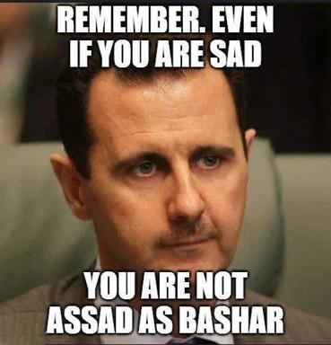 Political motivation-poster parody: a stern portrait of Assad with text that pivots from pep-talk ("even if you are sad") to dark comparison, mixing inspirational-meme format with geopolitical satire.